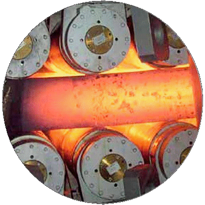 Hot steel slab passing between casting rolls